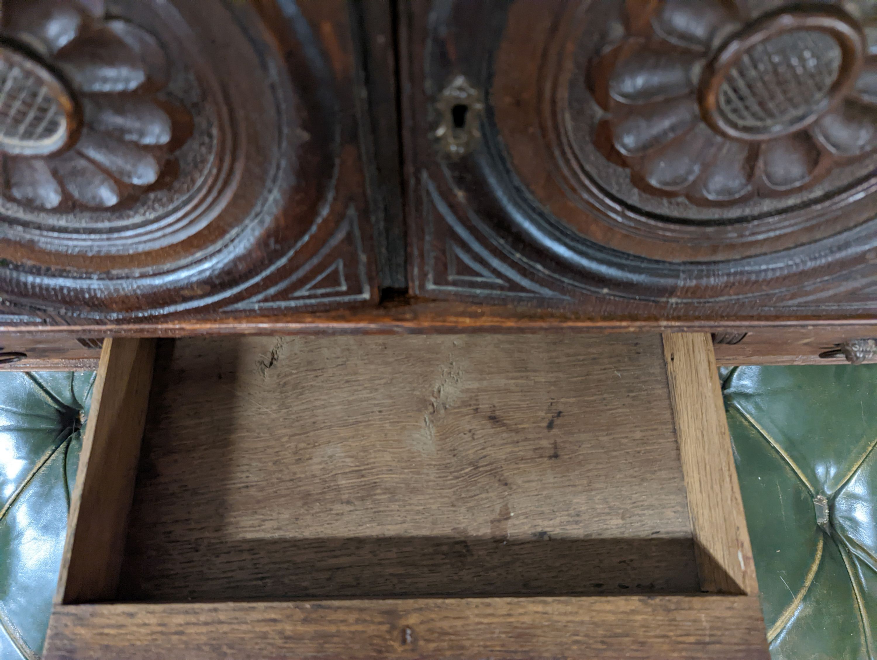 A Victorian carved oak Arts and Crafts wall cabinet, width 55cm, depth 18cm, height 68cm